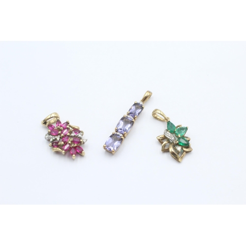 1024 - Three 9ct gold gemstone and diamond drop pendants, one ruby, one emerald and one iolite - approx. gr... 