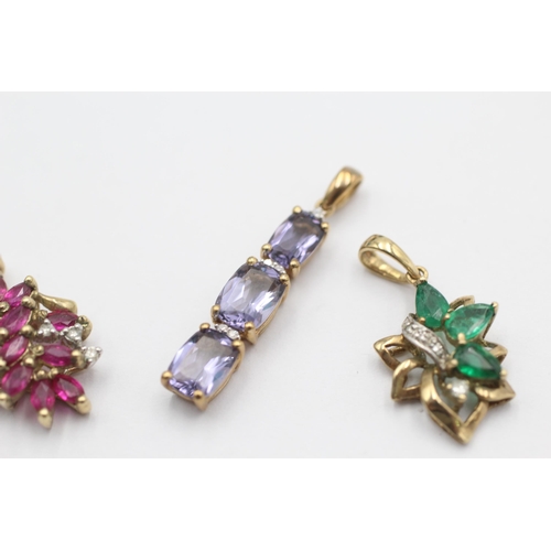 1024 - Three 9ct gold gemstone and diamond drop pendants, one ruby, one emerald and one iolite - approx. gr... 