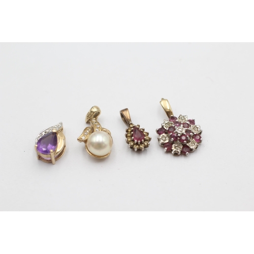 1026 - Four 9ct gold gemstone pendants to include ruby, amethyst, pearl etc. - approx. gross weight 3.6 gra... 