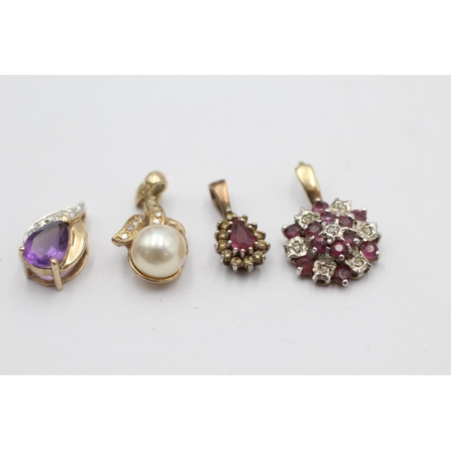 1026 - Four 9ct gold gemstone pendants to include ruby, amethyst, pearl etc. - approx. gross weight 3.6 gra... 