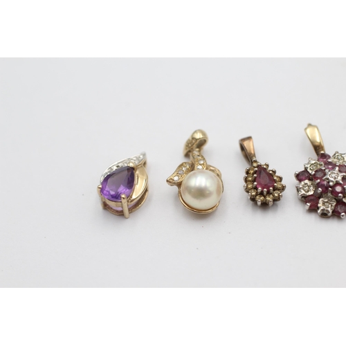 1026 - Four 9ct gold gemstone pendants to include ruby, amethyst, pearl etc. - approx. gross weight 3.6 gra... 