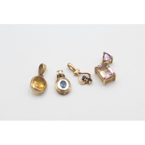 1027 - Four 9ct gold gemstone set pendants, two sapphire, one ametrine and one citrine - approx. gross weig... 