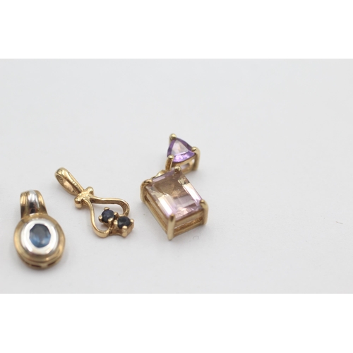 1027 - Four 9ct gold gemstone set pendants, two sapphire, one ametrine and one citrine - approx. gross weig... 