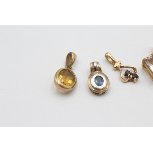 1027 - Four 9ct gold gemstone set pendants, two sapphire, one ametrine and one citrine - approx. gross weig... 