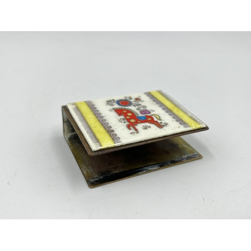 1235 - A vintage brass and enamel matchbox holder