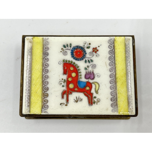 1235 - A vintage brass and enamel matchbox holder