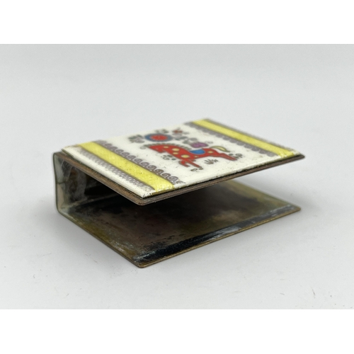 1235 - A vintage brass and enamel matchbox holder