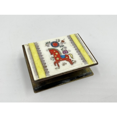 1235 - A vintage brass and enamel matchbox holder