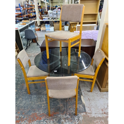 122 - Five pieces of 1970s furniture, one smoked glass and chrome plated circular dining table and four be... 