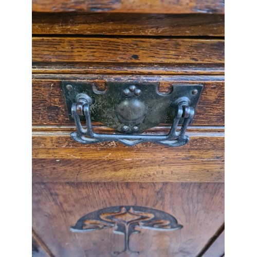 10 - An Art Nouveau carved oak sideboard with two drawers and two cupboard doors - approx. 93cm high x 12... 