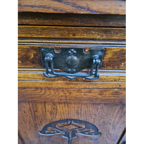 10 - An Art Nouveau carved oak sideboard with two drawers and two cupboard doors - approx. 93cm high x 12... 