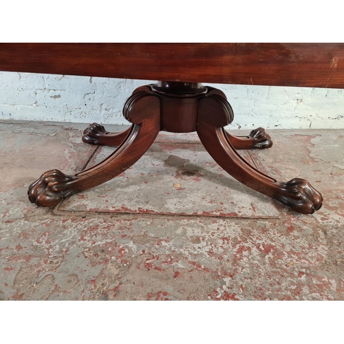 108 - A 19th century mahogany drop leaf dining table with four carved lion paw supports - approx. 73cm hig... 