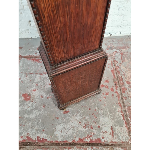 115 - A 1930s oak cased chiming granddaughter clock with pendulum - approx. 130cm high