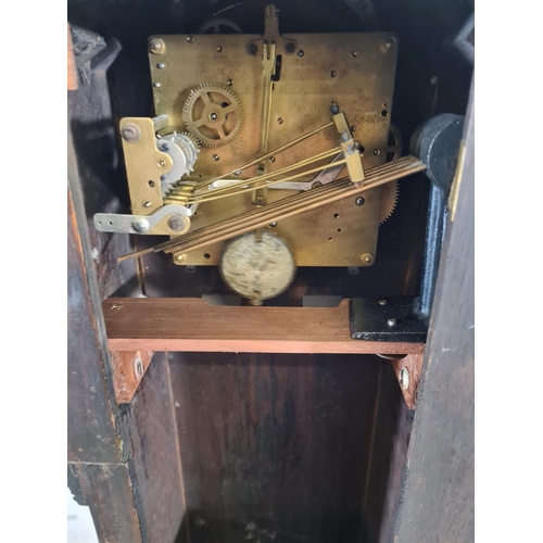 115 - A 1930s oak cased chiming granddaughter clock with pendulum - approx. 130cm high