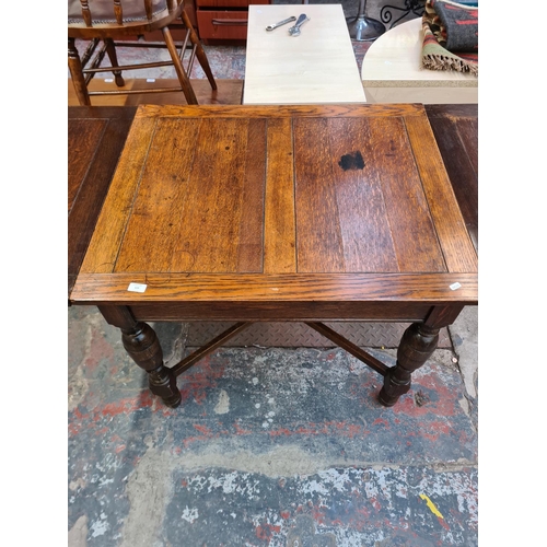 119 - A 1930s oak rectangular draw leaf dining table with baluster supports - approx. 75cm high x 76cm wid... 