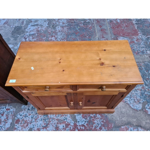 12 - A modern solid pine sideboard with two drawers and two cupboard doors - approx. 81cm high x 92cm wid... 