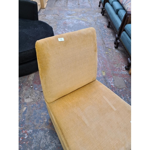 129 - A modern beige fabric upholstered lounge chair - approx. 88cm high x 63cm wide x 68cm deep