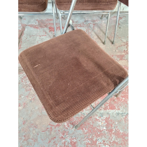 13 - A set of four 1970s brown upholstered and chrome plated folding chairs