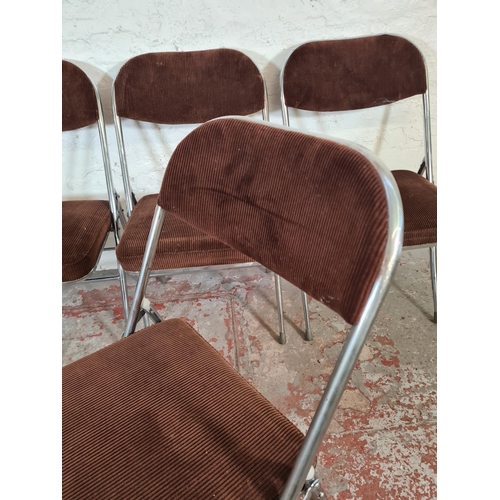 13 - A set of four 1970s brown upholstered and chrome plated folding chairs