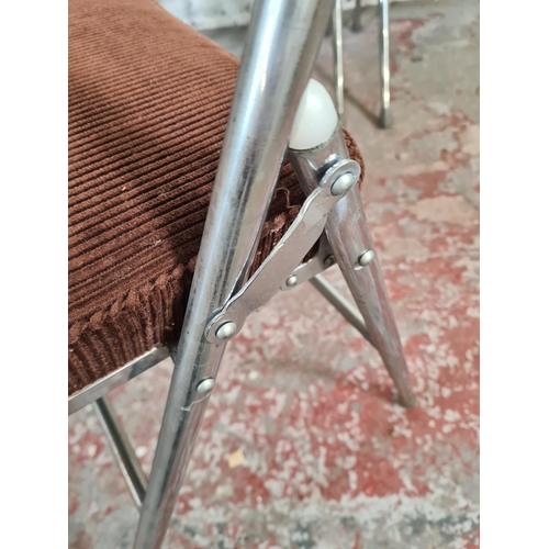 13 - A set of four 1970s brown upholstered and chrome plated folding chairs