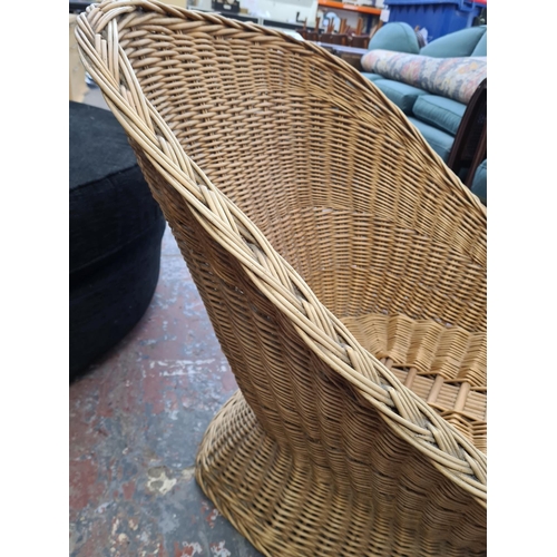 130 - Two pieces of modern wicker furniture, one tub chair and one circular foot stool