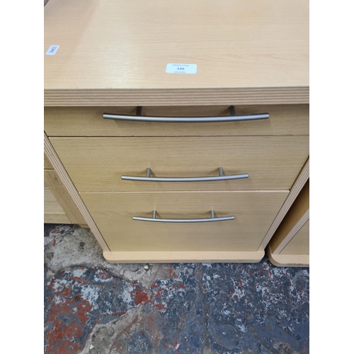 135 - A pair of modern beech effect three drawer office filing cabinets