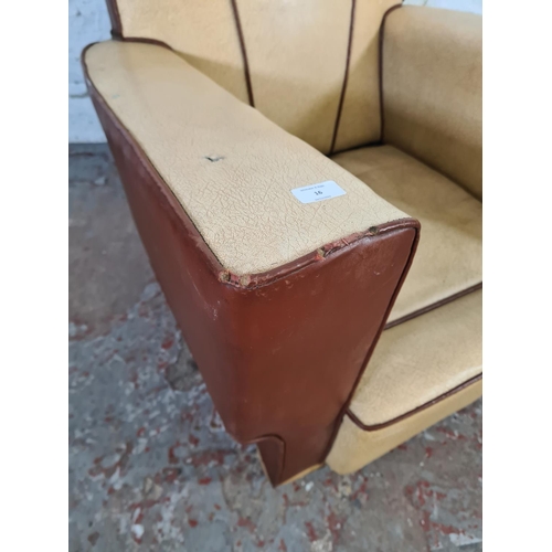 16 - An Art Deco brown and beige vinyl upholstered fan back armchair