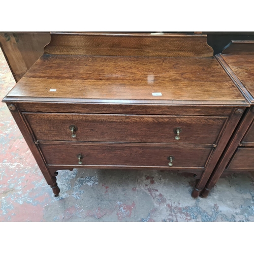 22 - A 1930s oak dressing table with upper bevelled edge mirror and two drawers - approx. 156cm high x 99... 