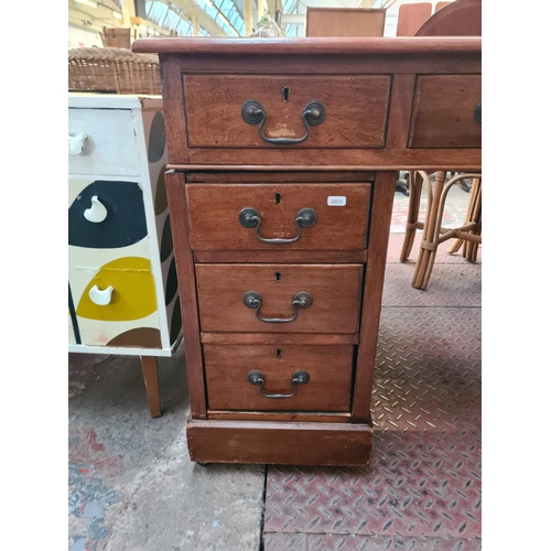 25 - An Edwardian mahogany pedestal desk with nine drawers and beige leather insert - approx. 73cm high x... 