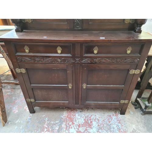 31 - A 17th century style carved oak court cupboard - approx. 151cm high x 137cm wide x 48cm deep