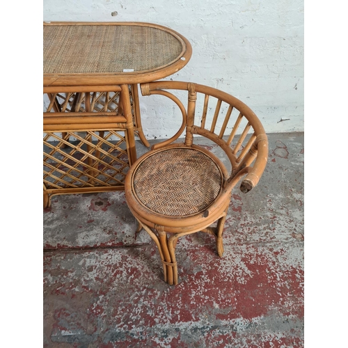 41 - A mid 20th century bamboo and wicker three piece dining suite comprising table and two chairs - appr... 