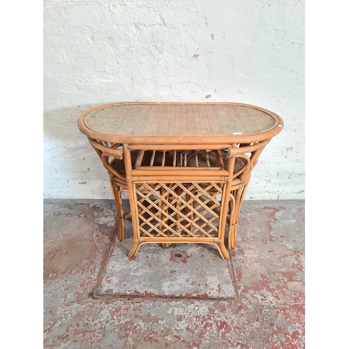 41 - A mid 20th century bamboo and wicker three piece dining suite comprising table and two chairs - appr... 