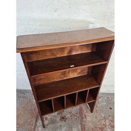 43 - A mid/late 20th century oak bookcase - approx. 138cm high x 91cm wide x 28cm deep