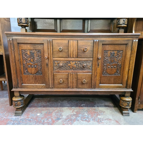 44 - A 17th century style carved oak court cupboard - approx. 129cm high x 136cm wide x 50cm deep