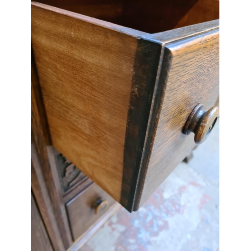 44 - A 17th century style carved oak court cupboard - approx. 129cm high x 136cm wide x 50cm deep