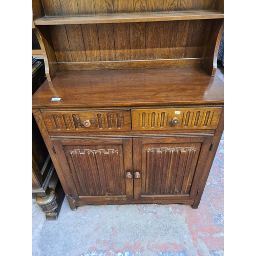 45 - An oak linenfold Dutch dresser - approx. 179cm high x 95cm wide x 44cm deep