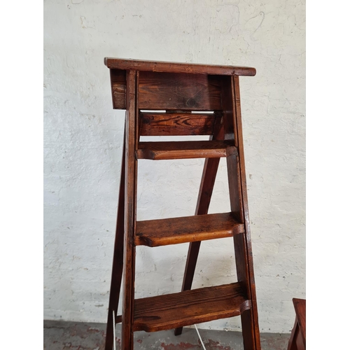 46 - Two pieces of pine furniture, one two tier plant stand - approx. 76cm high and one eight tread step ... 