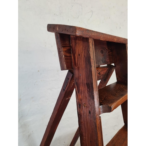 46 - Two pieces of pine furniture, one two tier plant stand - approx. 76cm high and one eight tread step ... 