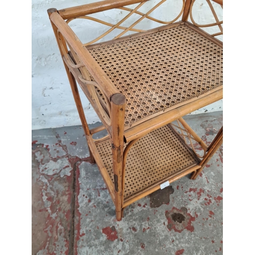 52 - A bamboo and wicker two tier side table - approx. 69cm high x 40cm wide x 31cm deep