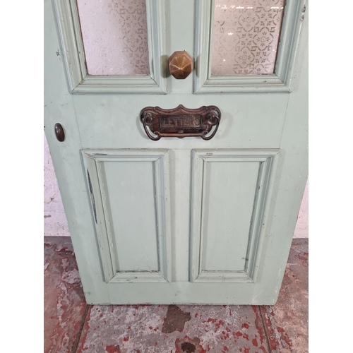 60 - A green painted pine exterior door with brass handle and letterbox - approx. 201cm high x 81cm wide