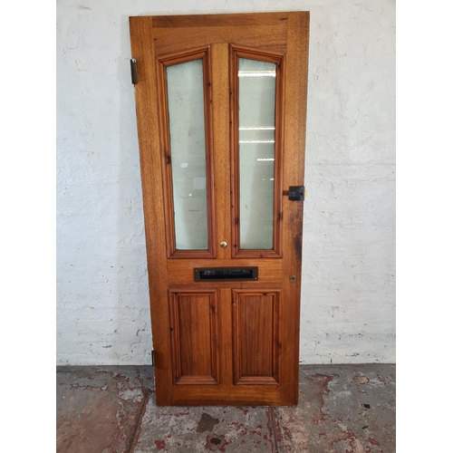 60 - A green painted pine exterior door with brass handle and letterbox - approx. 201cm high x 81cm wide