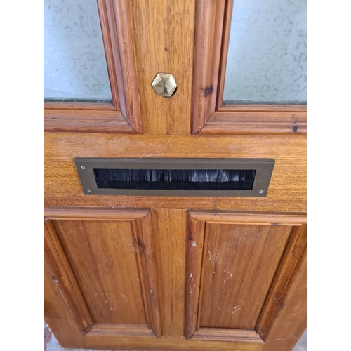 60 - A green painted pine exterior door with brass handle and letterbox - approx. 201cm high x 81cm wide