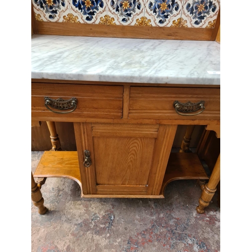 62 - An Edwardian satinwood washstand with marble top and ceramic tile splashback - approx. 128cm high x ... 