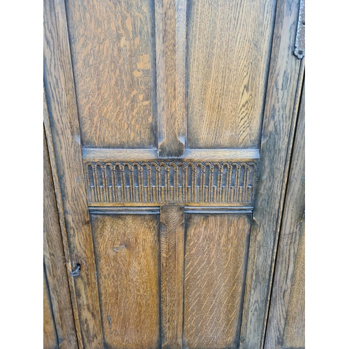 64 - An oak single door wardrobe - approx. 189cm high x 100cm wide x 60cm deep