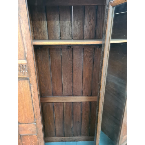 64 - An oak single door wardrobe - approx. 189cm high x 100cm wide x 60cm deep