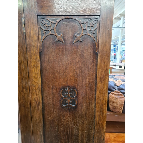 83 - An early 20th century oak mirror door wardrobe - approx. 187cm high x 118cm wide x 44cm deep