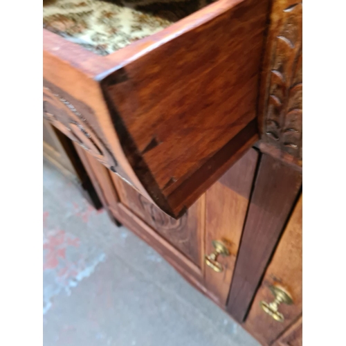 84 - An Edwardian carved mahogany sideboard with two drawers and two cupboard doors - approx. 93cm high x... 