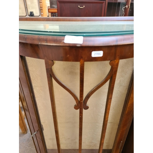 88 - A mid 20th century walnut bow fronted display cabinet with two glass shelves and cabriole supports -... 