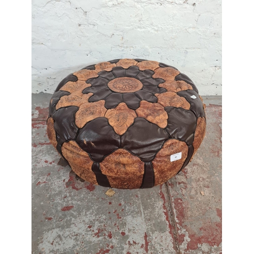 89 - A mid 20th century Moroccan brown leather circular footstool