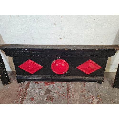 9 - A Victorian black and red painted fire surround